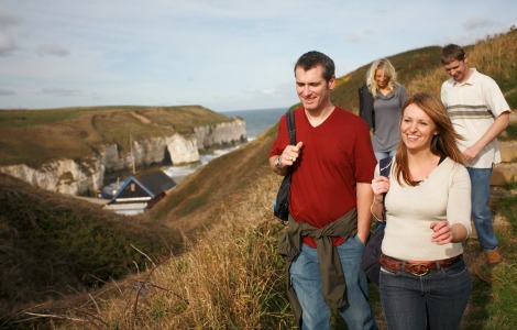 Opens in a new window People walking on the cliff tops